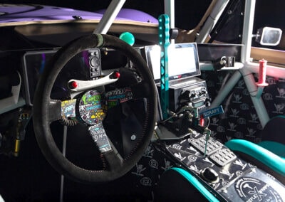 High-tech vehicle dashboard with Switch-Pros power switch system, gauges, and custom controls for off-road vehicles.